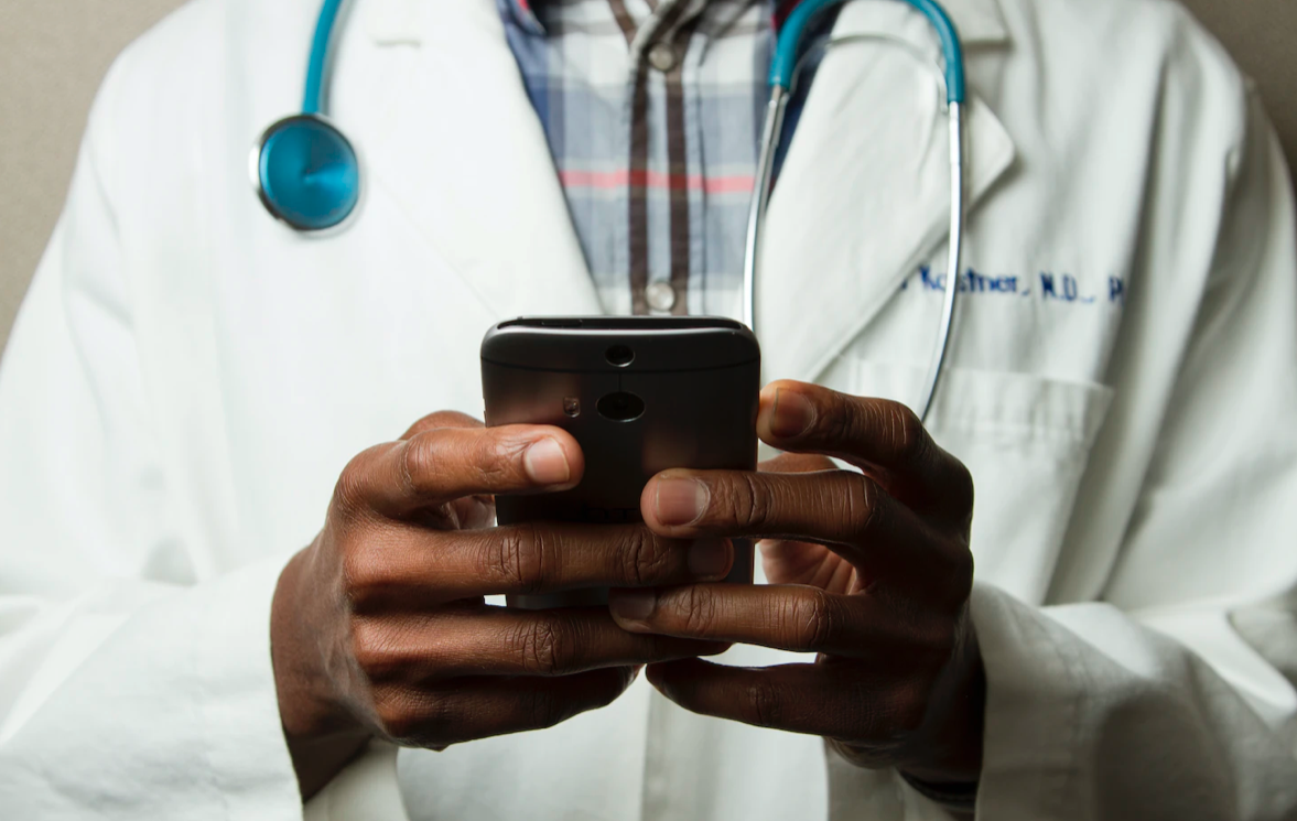 a doctor using his phone