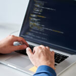 A developer coding on their computer