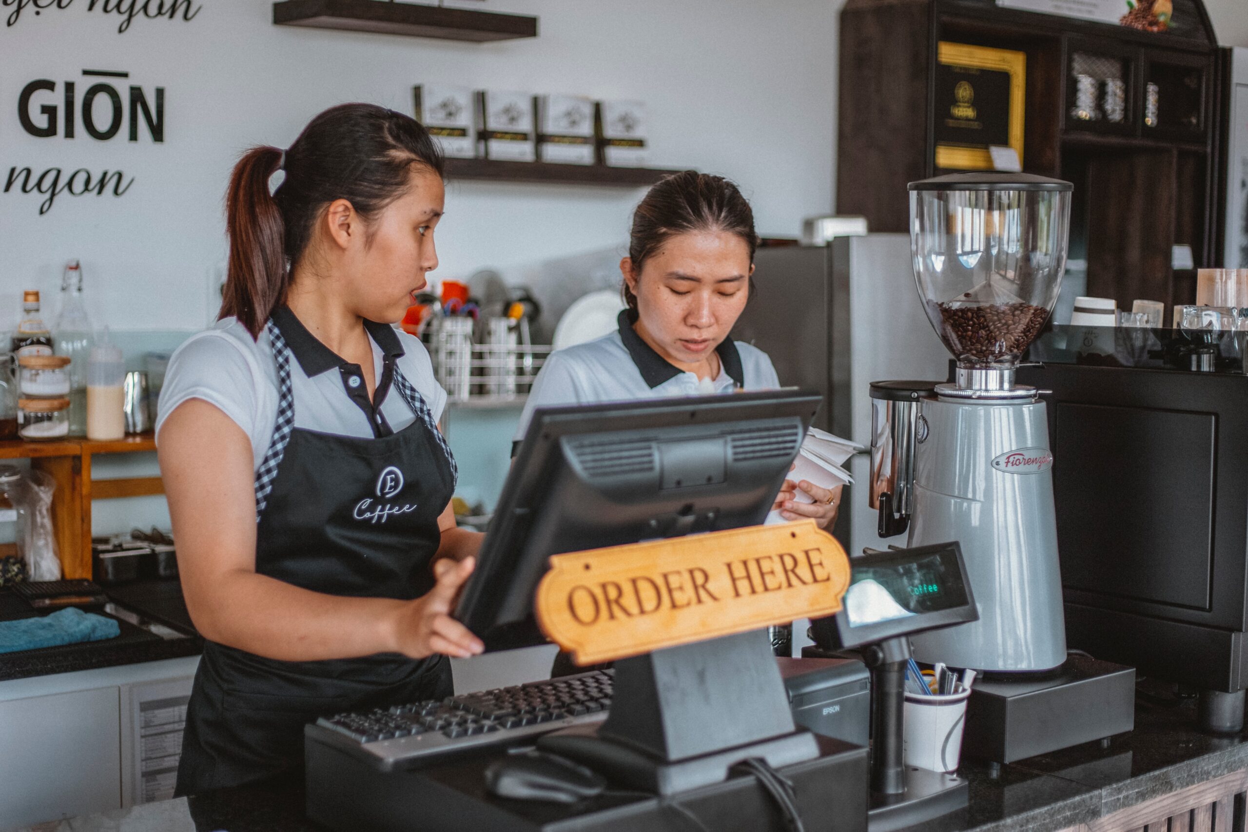 two baristas working