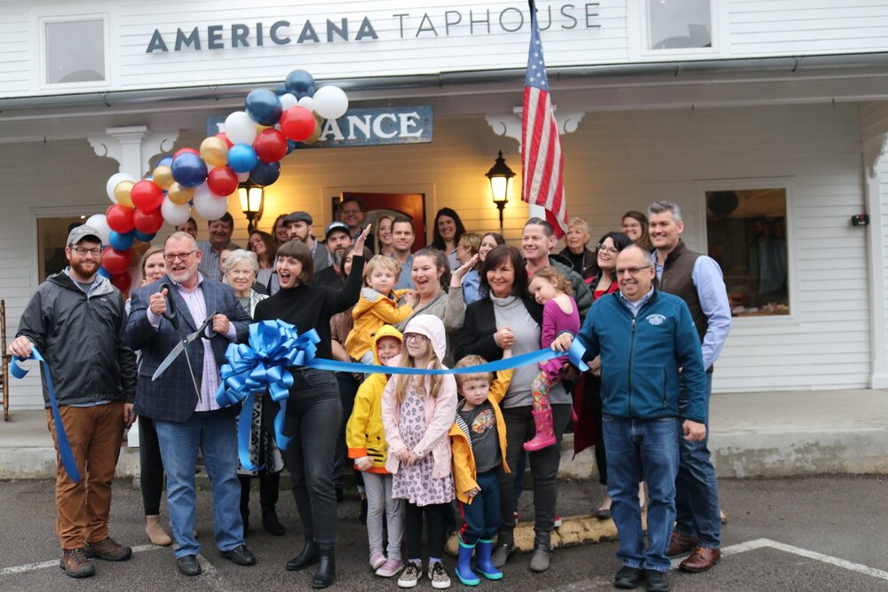 a group of people at the opening of Americana Taphouse