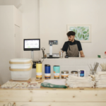 Cashier standing behind a counter at a store